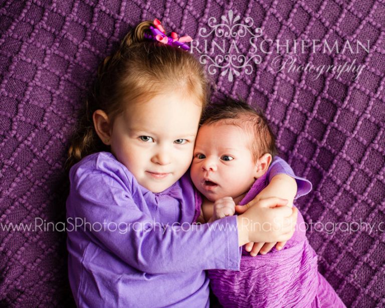 newborn and sister portrait